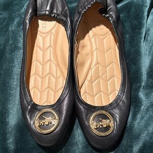 Coach Black Leather Flats with Gold Emblem